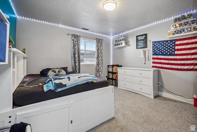 2448 W Anne Ave S, West Haven, UT 84401 - bedroom with light carpet, a textured ceiling, and visible vents