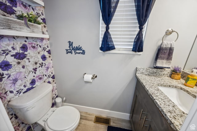 2448 W Anne Ave S, West Haven, UT 84401 - bathroom with toilet, wood finished floors, vanity, baseboards, and visible vents
