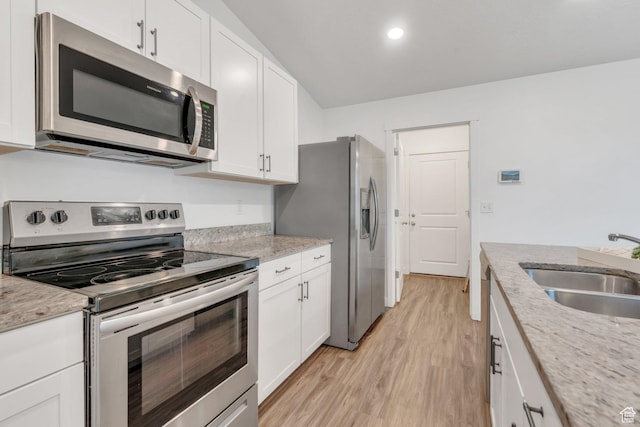 1784 S 360 W, Payson, UT 84651 - kitchen featuring light stone counters, a sink, light wood-type flooring, white cabinets, and appliances with stainless steel finishes