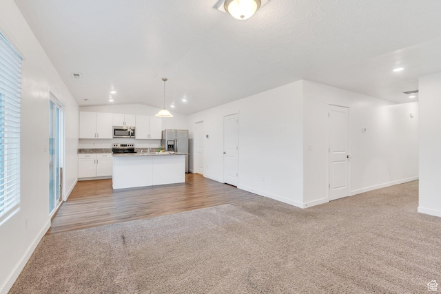 1784 S 360 W, Payson, UT 84651 - kitchen featuring light colored carpet, baseboards, open floor plan, and appliances with stainless steel finishes