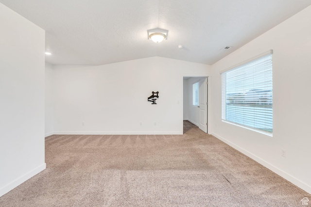1784 S 360 W, Payson, UT 84651 - empty room with baseboards, vaulted ceiling, visible vents, and light colored carpet