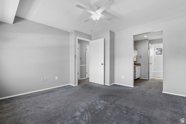 81 W Pheasantbrook Cir N, Centerville, UT 84014 - unfurnished bedroom featuring dark carpet, ensuite bath, baseboards, and ceiling fan