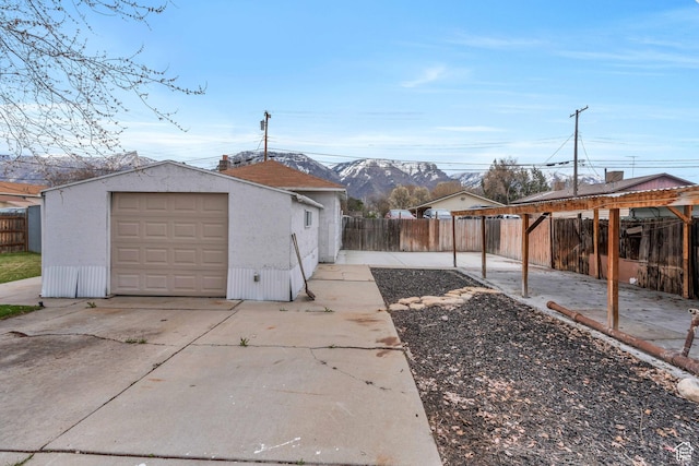 682 N 700 W, Provo, UT 84601 - view of yard featuring a fenced backyard, an outdoor structure, concrete driveway, and a garage