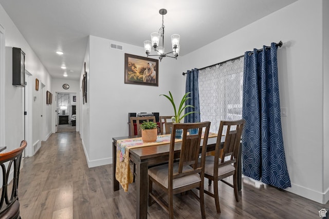 551 S 1020 W Unit 102, American Fork, UT 84003 - dining area featuring wood finished floors, visible vents, baseboards, and an inviting chandelier