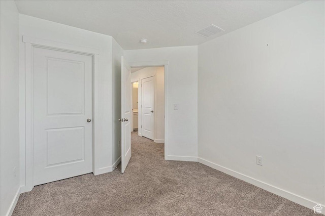 278 N Portside Ln, Saratoga Springs, UT 84045 - unfurnished bedroom featuring visible vents, light carpet, and baseboards