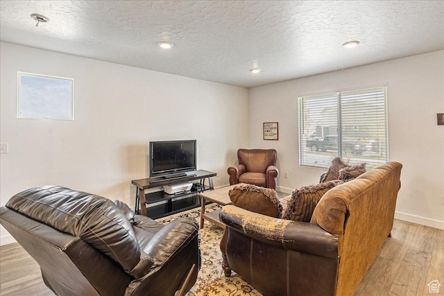 278 N Portside Ln, Saratoga Springs, UT 84045 - living area featuring light wood finished floors, baseboards, recessed lighting, and a textured ceiling