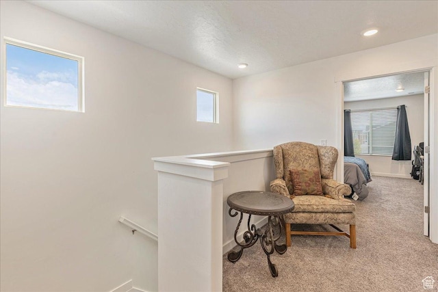 278 N Portside Ln, Saratoga Springs, UT 84045 - sitting room with baseboards, carpet floors, an upstairs landing, and plenty of natural light
