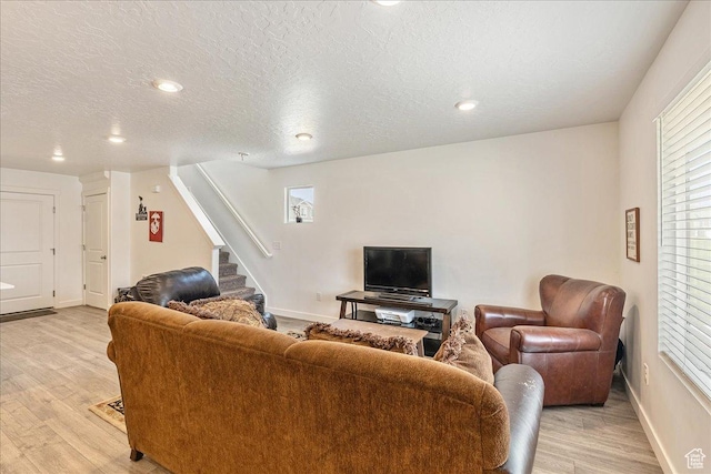 278 N Portside Ln, Saratoga Springs, UT 84045 - living area with stairs, a textured ceiling, light wood-type flooring, baseboards, and recessed lighting
