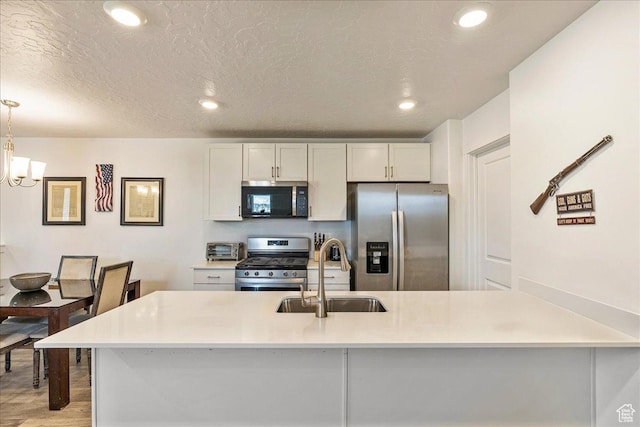 278 N Portside Ln, Saratoga Springs, UT 84045 - kitchen featuring recessed lighting, appliances with stainless steel finishes, a sink, and light countertops