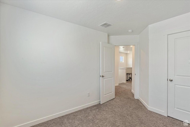 278 N Portside Ln, Saratoga Springs, UT 84045 - unfurnished bedroom featuring light carpet, baseboards, visible vents, and a textured ceiling