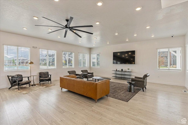 278 N Portside Ln, Saratoga Springs, UT 84045 - living room featuring baseboards, recessed lighting, and light wood-style floors