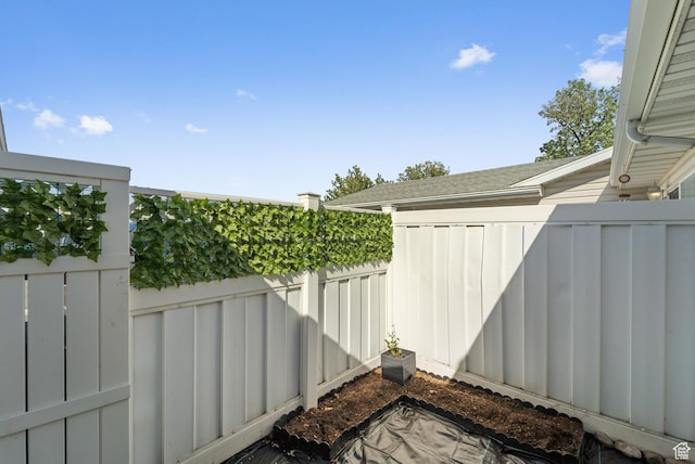 view of patio featuring fence