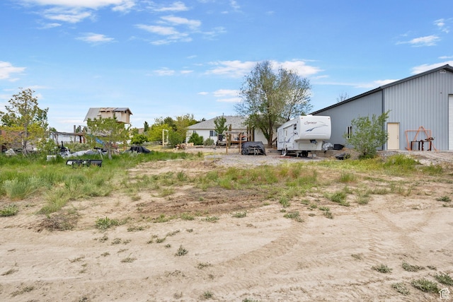 view of yard with a detached garage