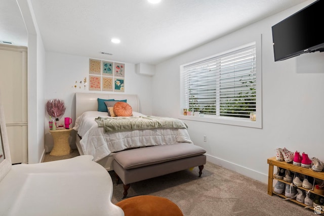 carpeted bedroom with recessed lighting, baseboards, and visible vents