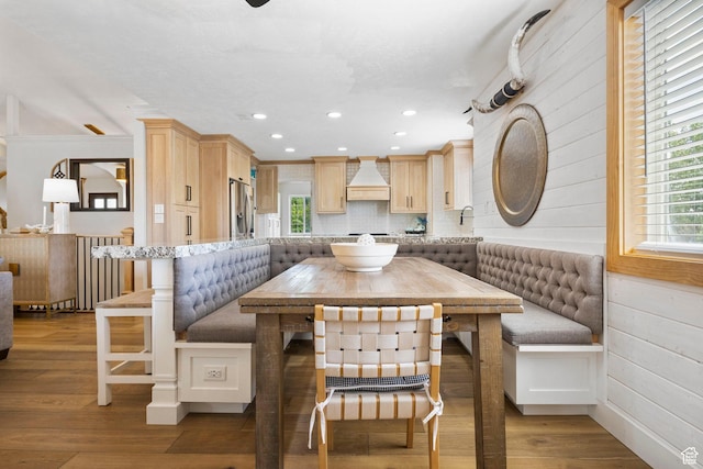 dining room with recessed lighting, wood finished floors, and breakfast area