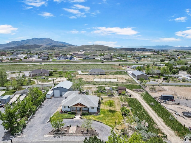 drone / aerial view featuring a residential view and a mountain view