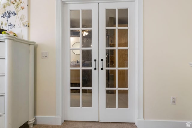 room details with carpet floors, baseboards, and french doors