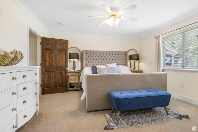 bedroom featuring light colored carpet, ornamental molding, and ceiling fan