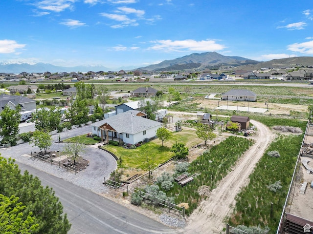 drone / aerial view with a residential view and a mountain view