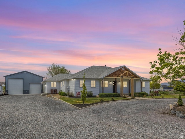 ranch-style home featuring an outdoor structure and a garage