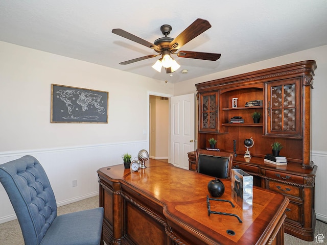 office space with a ceiling fan