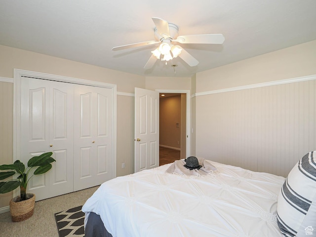 bedroom featuring carpet, a closet, and a ceiling fan
