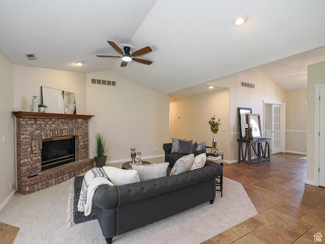living room featuring baseboards, vaulted ceiling, visible vents, and a ceiling fan