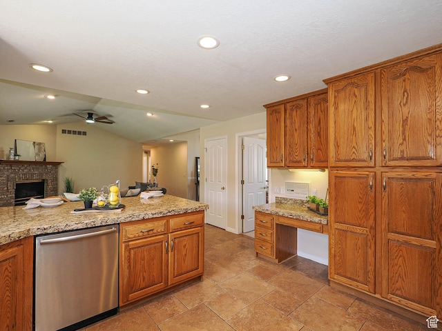kitchen featuring built in desk, vaulted ceiling, dishwasher, visible vents, and a ceiling fan