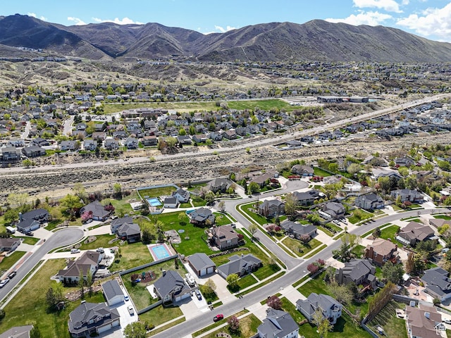 birds eye view of property with a residential view and a mountain view