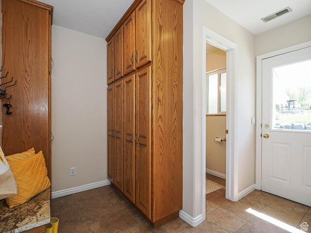 interior space with visible vents and baseboards