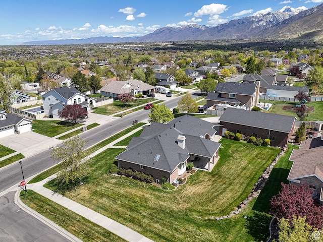 aerial view featuring a mountain view and a residential view