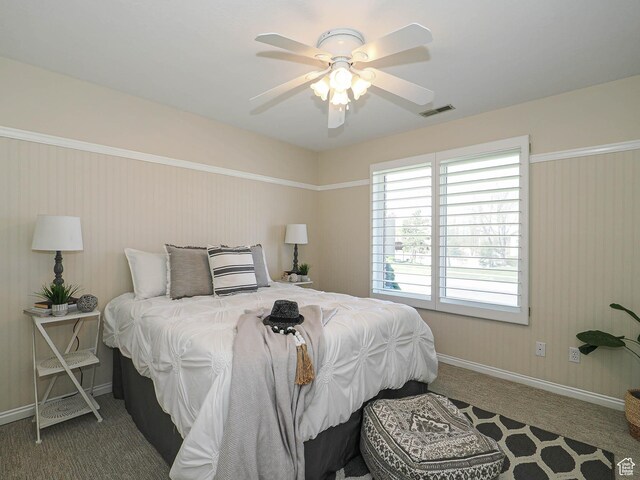 bedroom featuring ceiling fan, carpet floors, visible vents, and baseboards