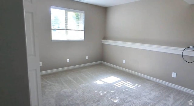 empty room with carpet flooring and baseboards