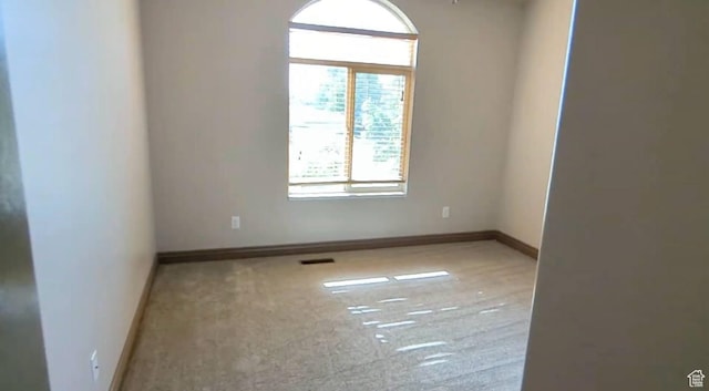empty room featuring baseboards