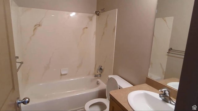 bathroom featuring toilet, bathtub / shower combination, and vanity