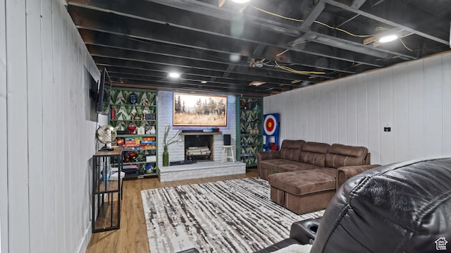 1642 W 2700 S, Syracuse, UT 84075 - living room with wood walls, a brick fireplace, and wood finished floors