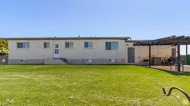 1642 W 2700 S, Syracuse, UT 84075 - back of house featuring a pergola, a yard, and brick siding