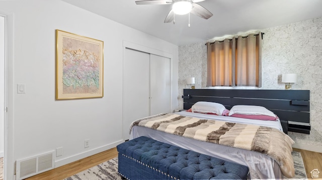 1642 W 2700 S, Syracuse, UT 84075 - bedroom with baseboards, visible vents, a ceiling fan, wood finished floors, and a closet