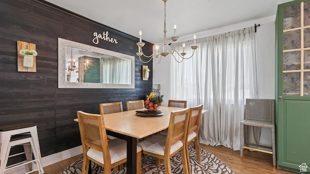 1642 W 2700 S, Syracuse, UT 84075 - dining area featuring wooden walls, wood finished floors, and an inviting chandelier