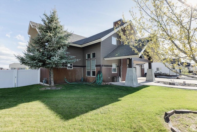 9 W Cedar Ln, Franklin, ID 83237 - back of property with a shingled roof and an attached garage
