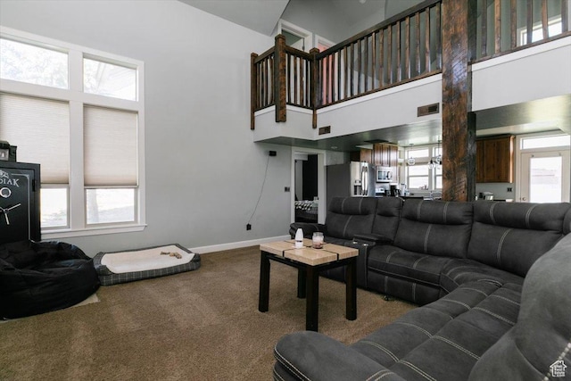 9 W Cedar Ln, Franklin, ID 83237 - carpeted living room with high vaulted ceiling and baseboards