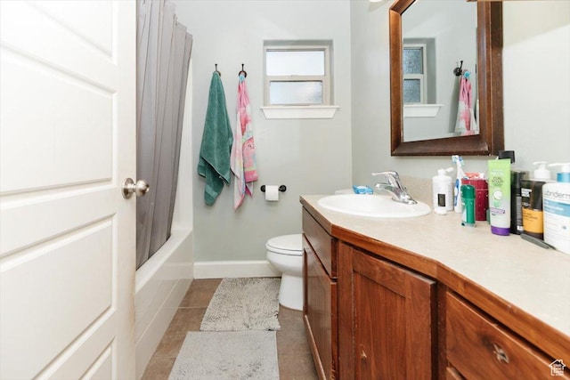 9 W Cedar Ln, Franklin, ID 83237 - full bath featuring vanity, tile patterned flooring, toilet, baseboards, and shower / bath combo