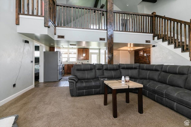 9 W Cedar Ln, Franklin, ID 83237 - carpeted living area with a towering ceiling, stairs, and baseboards