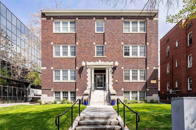 555 E 100 S Unit 105, Salt Lake City, UT 84102 - view of front of house with brick siding and a front yard