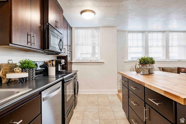 555 E 100 S Unit 105, Salt Lake City, UT 84102 - kitchen featuring butcher block countertops, black microwave, dishwasher, electric range, and baseboards