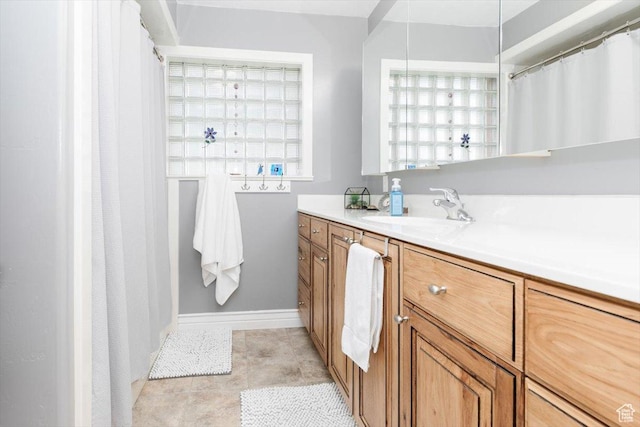 449 S 2nd E, Preston, ID 83263 - bathroom featuring baseboards, vanity, and tile patterned floors