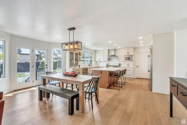 2696 W Red Robin Ct, Lehi, UT 84043 - dining room with a chandelier, light wood-type flooring, and recessed lighting