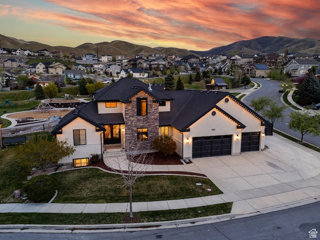 2696 W Red Robin Ct, Lehi, UT 84043 - view of front of home with stone siding, an attached garage, a mountain view, and concrete driveway