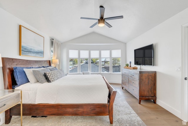 2696 W Red Robin Ct, Lehi, UT 84043 - bedroom with ceiling fan, vaulted ceiling, baseboards, and light wood-type flooring