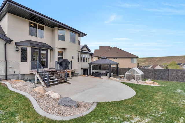 2696 W Red Robin Ct, Lehi, UT 84043 - rear view of house with a gazebo, fence, a patio area, a greenhouse, and stucco siding